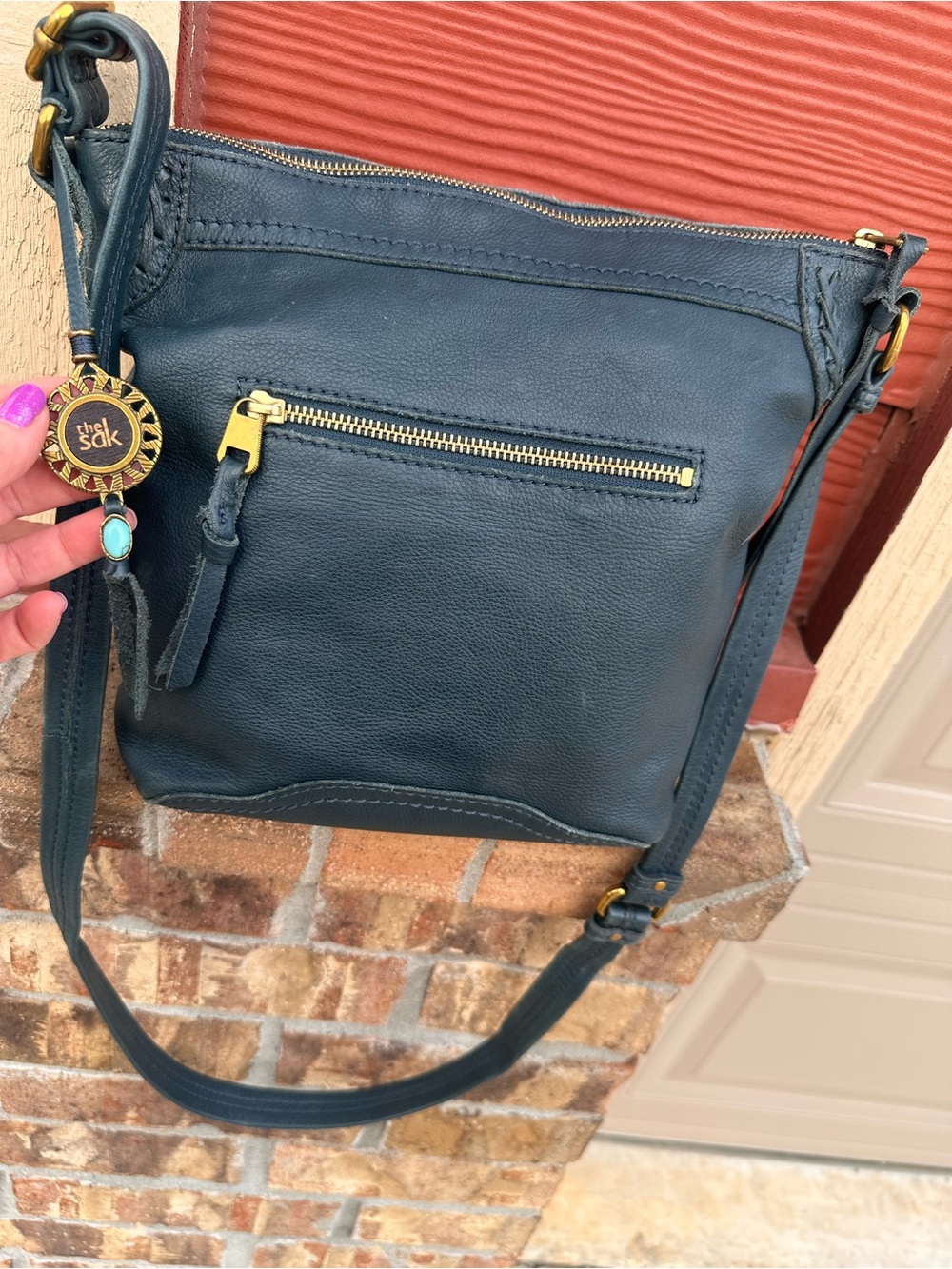The Sak Teal Leather Crossbody Bag with Gold Accents
